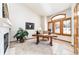 Bright home office with a fireplace, natural light, and a cozy atmosphere at 8316 Green Island Cir, Lone Tree, CO 80124