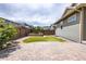 Backyard features a well-manicured lawn, garden beds, and a paver patio for outdoor enjoyment at 15392 W 49Th Ave, Golden, CO 80403