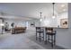 Spacious finished basement with bar, seating, and a modern, open floor plan at 15392 W 49Th Ave, Golden, CO 80403