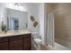 Modern bathroom featuring a vanity with ample counter space and a shower with a tub at 15392 W 49Th Ave, Golden, CO 80403