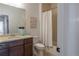 Bathroom with a shower and tub, white shower curtain, and a single vanity sink at 15392 W 49Th Ave, Golden, CO 80403