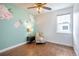 Bedroom with a large window and a floral accent wall at 15392 W 49Th Ave, Golden, CO 80403