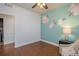 Bedroom with a floral accent wall and a view of the hallway at 15392 W 49Th Ave, Golden, CO 80403