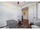 Modern home office with glass doors, dark floors, and neutral decor at 15392 W 49Th Ave, Golden, CO 80403