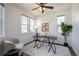 Bright and airy home office with ample natural light, ceiling fan, and hardwood floors at 15392 W 49Th Ave, Golden, CO 80403