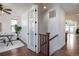 Open view of home office showing access to stairway with hardwood floors at 15392 W 49Th Ave, Golden, CO 80403