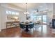 Inviting living room with modern furnishings and a dining table, showcasing natural light and open space at 15392 W 49Th Ave, Golden, CO 80403