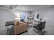 Cozy living room with plush seating, a large window, and built-in shelving at 15392 W 49Th Ave, Golden, CO 80403