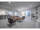 Finished basement with stylish seating, large window, and custom built-in shelves at 15392 W 49Th Ave, Golden, CO 80403