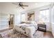 Comfortable main bedroom with ensuite bathroom access, natural light, and soft textures for a calming ambiance at 15392 W 49Th Ave, Golden, CO 80403