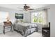 Cozy bedroom featuring a ceiling fan, neutral colors, and natural light, creating a relaxing retreat at 3202 S Dahlia St, Denver, CO 80222
