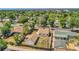 Spacious backyard, detached garage, mature trees providing shade, with city views in the distance at 2226 Fulton St, Aurora, CO 80010