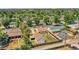 Spacious backyard, detached garage, mature trees providing shade, with city views in the distance at 2226 Fulton St, Aurora, CO 80010