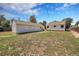 Large backyard with lush green grass and detached garage at 2226 Fulton St, Aurora, CO 80010
