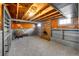Basement featuring a brick fireplace, built-ins, and gray carpeting at 2226 Fulton St, Aurora, CO 80010