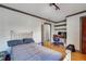 Relaxing bedroom with hardwood floors, a study desk, and an open closet that offers storage space at 2226 Fulton St, Aurora, CO 80010