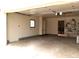 View of the spacious garage with built-in shelving and pegboard for tool organization at 2226 Fulton St, Aurora, CO 80010