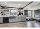 Beautiful modern kitchen featuring stainless steel appliances, open shelving, and a large sink at 2226 Fulton St, Aurora, CO 80010