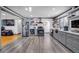 Modern kitchen with stainless steel appliances, open shelving, and view into the Gathering room at 2226 Fulton St, Aurora, CO 80010