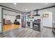 Modern kitchen featuring stainless steel appliances, open shelving, and an open layout at 2226 Fulton St, Aurora, CO 80010