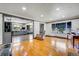 Spacious living room featuring hardwood floors and seamless flow into the contemporary kitchen at 2226 Fulton St, Aurora, CO 80010