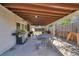 Covered back patio area with grill and outdoor dining table set at 2226 Fulton St, Aurora, CO 80010