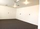 Empty room with neutral walls and new carpet at 2226 Fulton St, Aurora, CO 80010