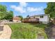 Spacious backyard featuring a well-maintained lawn and a wooden deck, ideal for outdoor entertaining at 4505 W Gill Pl, Denver, CO 80219