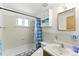 Bright bathroom with daisy-themed shower curtain at 4505 W Gill Pl, Denver, CO 80219