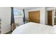 Bright bedroom with wood-trimmed window and closet at 4505 W Gill Pl, Denver, CO 80219