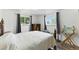 Bright bedroom with wood-trimmed windows and vintage decor at 4505 W Gill Pl, Denver, CO 80219
