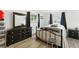 Bedroom featuring a dark wood dresser and wrought iron bed frame at 4505 W Gill Pl, Denver, CO 80219