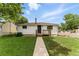 Charming home with a well-maintained lawn and welcoming front porch at 4505 W Gill Pl, Denver, CO 80219