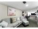 Living room with gray sofa and workspace at 4505 W Gill Pl, Denver, CO 80219