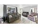 Bright living room with hardwood floors, gray sofas, and lots of natural light at 4505 W Gill Pl, Denver, CO 80219