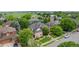 Aerial view of a beautiful home with a well-maintained lawn and mature trees in a residential area at 1313 Jade Ln, Longmont, CO 80504