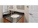 Bathroom featuring a dark countertop with sink and brushed nickel hardware at 1313 Jade Ln, Longmont, CO 80504