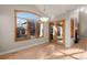 Bright dining area with hardwood floors, window and glass doors to patio at 1313 Jade Ln, Longmont, CO 80504