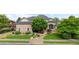 Charming stone-clad home with a lush front yard, mature trees, and well-manicured landscaping at 1313 Jade Ln, Longmont, CO 80504