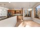 Bright kitchen and dining space with wood cabinets, hardwood floors and natural light at 1313 Jade Ln, Longmont, CO 80504