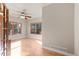 Bright living room featuring hardwood floors and large windows offering ample natural light at 1313 Jade Ln, Longmont, CO 80504