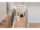 Spacious living room with high ceilings, hardwood floors, and a cozy fireplace as a focal point at 1313 Jade Ln, Longmont, CO 80504