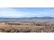 Expansive view of the Rocky Mountains with snow-capped peaks, overlooking the landscape at 1313 Jade Ln, Longmont, CO 80504