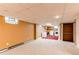 Spacious basement area with laundry appliances, storage, and neutral carpet at 16291 E 7Th Dr, Aurora, CO 80011