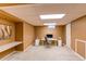 Finished basement space offers a bright home office setup with sleek desk, chair, and convenient built-in workspace at 16291 E 7Th Dr, Aurora, CO 80011