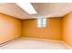 Finished basement with carpeted floor, baseboard heat, and painted walls at 16291 E 7Th Dr, Aurora, CO 80011