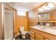 Bathroom with a tiled vanity, step-in shower, and window at 16291 E 7Th Dr, Aurora, CO 80011