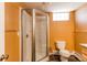 Bathroom with a walk-in shower with glass doors, toilet, tile flooring, and vanity at 16291 E 7Th Dr, Aurora, CO 80011