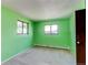 Bedroom with window, light carpet and vibrant green walls at 16291 E 7Th Dr, Aurora, CO 80011