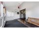 Well-lit entryway with mailboxes, bench, and secure access at 7770 W 38Th Ave # 207, Wheat Ridge, CO 80033